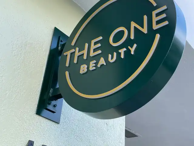 The One Beauty projecting blade sign
